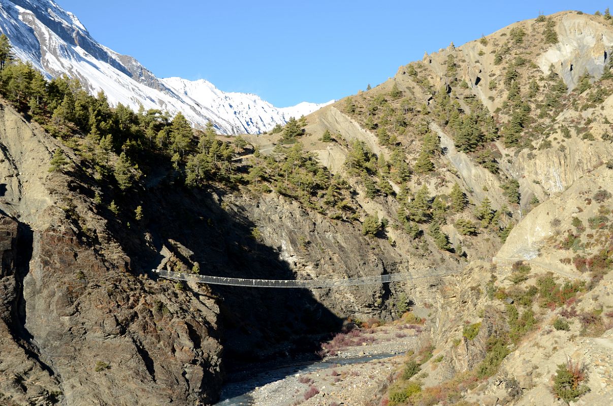 03 The Trail To Khangsar Crosses The Bridge Over The Jharsang Khola With La Grande Barrier Ahead After Leaving Manang On Trek To Tilicho Tal Lake 